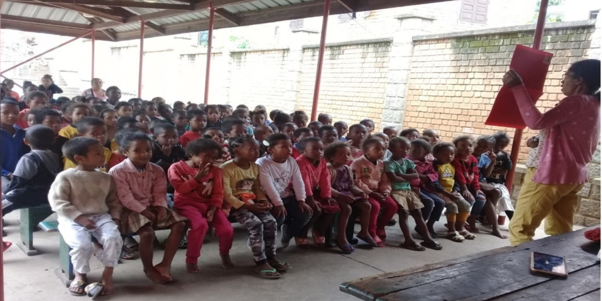 Children gather for a group lesson at the Madagascar Street Kids Center, a place to learn, build friendships, and grow.
