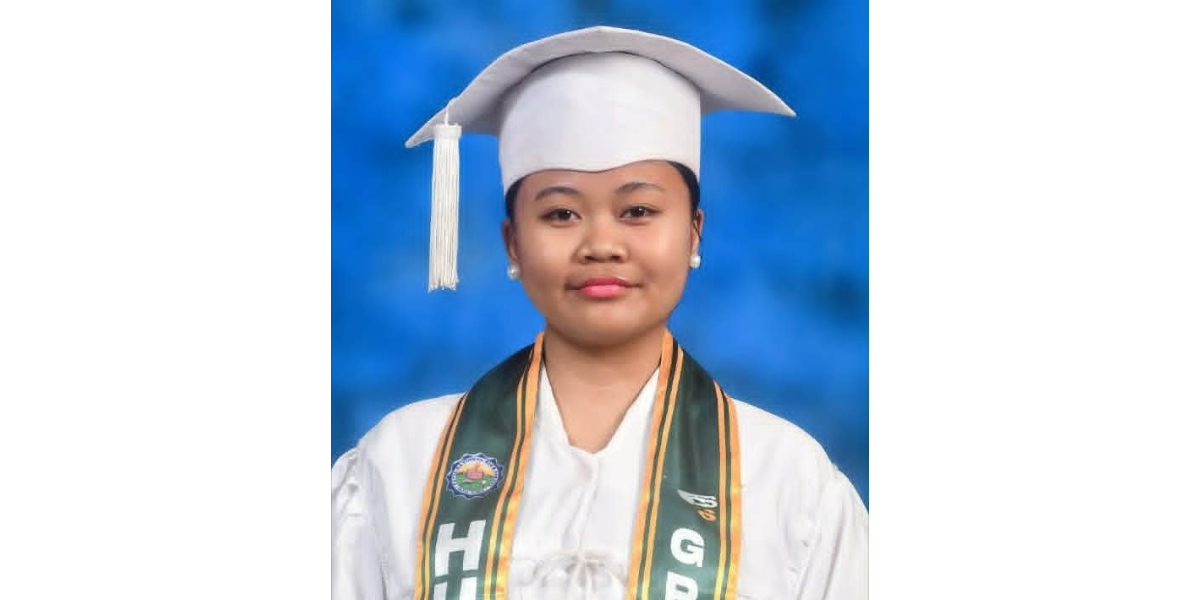 Danielle in her graduation regalia