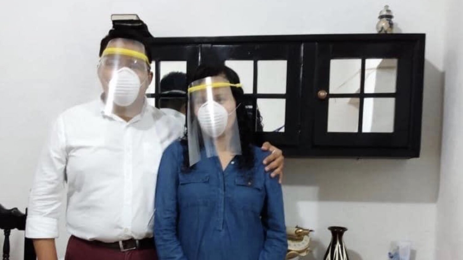 couple wearing faceshield