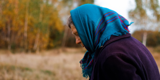 Senior citizen with kerchief on head